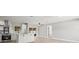 Beautiful open floorplan featuring a modern kitchen with an island and seamless transition to the living area at 2433 Blind Pond Ave, Lutz, FL 33549