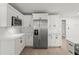 Modern kitchen features white cabinets, stainless steel appliances, and stylish countertops at 2433 Blind Pond Ave, Lutz, FL 33549