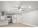 Spacious living room view into kitchen area, showcasing an open floor plan at 2433 Blind Pond Ave, Lutz, FL 33549