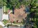 A high angle view of the property displaying the roof, screened-in pool, and backyard shed at 2903 Manor Ridge Pl, Valrico, FL 33596
