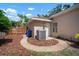 Paver walkway from home back yard with AC unit and partial fence at 2903 Manor Ridge Pl, Valrico, FL 33596