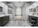 Elegant bathroom featuring a soaking tub, dual vanity sinks, and a sleek walk-in shower at 2903 Manor Ridge Pl, Valrico, FL 33596