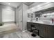 Elegant bathroom featuring a soaking tub, modern vanity, and sleek finishes at 2903 Manor Ridge Pl, Valrico, FL 33596