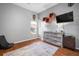 Bedroom featuring floating shelves, a console, and a comfortable chair at 2903 Manor Ridge Pl, Valrico, FL 33596