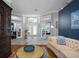 Inviting foyer with views into adjacent rooms, decorative glass double doors and tile floors at 2903 Manor Ridge Pl, Valrico, FL 33596