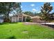 Well maintained single-story home featuring green grass, mature landscaping, and a charming facade at 2903 Manor Ridge Pl, Valrico, FL 33596