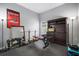 Home gym with exercise equipment and a Super Bowl Champions Tampa Bay Buccaneers banner at 2903 Manor Ridge Pl, Valrico, FL 33596