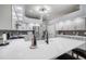Bright kitchen features white cabinets, stainless steel appliances and a large island with seating at 2903 Manor Ridge Pl, Valrico, FL 33596