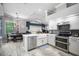 Well-lit kitchen features an eat-in area and modern stainless steel appliances at 2903 Manor Ridge Pl, Valrico, FL 33596