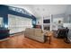 Spacious living room with hardwood floors, a fireplace, and large windows at 2903 Manor Ridge Pl, Valrico, FL 33596