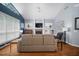 Living room with hardwood floors, fireplace, and neutral-toned furniture at 2903 Manor Ridge Pl, Valrico, FL 33596