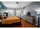 Main bedroom with hardwood floors, and large windows that let in natural light at 2903 Manor Ridge Pl, Valrico, FL 33596