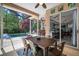 Covered patio features outdoor seating and dining area with view of pool at 2903 Manor Ridge Pl, Valrico, FL 33596