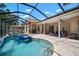 Wide view of pool and patio with screened lanai and outdoor amenities at 2903 Manor Ridge Pl, Valrico, FL 33596