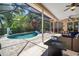 Wide view of patio area featuring a private pool, bar, and seating at 2903 Manor Ridge Pl, Valrico, FL 33596