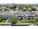 Overhead view reveals modern residences with well-maintained lawns, fences, and outdoor entertainment areas at 307 S Arrawana Ave # 100, Tampa, FL 33609