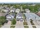 Aerial view of the townhome community showing well maintained landscaping and ample parking at 307 S Arrawana Ave # 100, Tampa, FL 33609