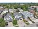 An aerial view of a neighborhood with modern homes, showcasing driveways and lush landscaping at 307 S Arrawana Ave # 100, Tampa, FL 33609