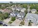 An aerial shot captures the rooftops of similar homes, with neatly arranged driveways and green surroundings at 307 S Arrawana Ave # 100, Tampa, FL 33609