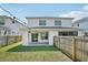 Backyard featuring a covered patio, string lights, and fenced yard at 307 S Arrawana Ave # 100, Tampa, FL 33609