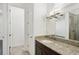 Bathroom with granite countertops, single vanity, and a glass door shower at 307 S Arrawana Ave # 100, Tampa, FL 33609