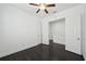 The bedroom offers dark wood floors, a ceiling fan, closet, and natural light at 307 S Arrawana Ave # 100, Tampa, FL 33609