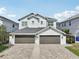 Charming exterior of a two-story house with two-car garages and paved driveway at 307 S Arrawana Ave # 100, Tampa, FL 33609