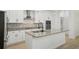 Modern kitchen with stainless steel appliances, granite countertops, and a center island at 307 S Arrawana Ave # 100, Tampa, FL 33609