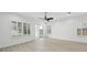 Bright, open-concept living room featuring white walls and hardwood floors at 307 S Arrawana Ave # 100, Tampa, FL 33609