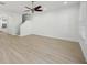 Open concept living room with archway and hardwood floors at 307 S Arrawana Ave # 100, Tampa, FL 33609