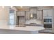 Modern kitchen featuring white quartz countertops, stainless steel appliances, and gray cabinetry at 3206 Lumber Falls Dr, Plant City, FL 33565