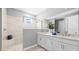 Sleek bathroom with a glass-enclosed shower, double vanity sinks, and neutral tones for a modern spa-like feel at 3404 Lumber Falls Dr, Plant City, FL 33565