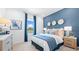 Comfortable bedroom featuring a bed with blue accents, a side table and a window at 3404 Lumber Falls Dr, Plant City, FL 33565