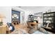 Stylish flex space with contemporary decor, including a round desk and woven chairs at 3404 Lumber Falls Dr, Plant City, FL 33565