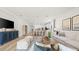 Open-concept living room with a dining area, modern furniture, and lots of natural light at 3404 Lumber Falls Dr, Plant City, FL 33565