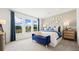 Inviting main bedroom featuring an accent wall, large windows and neutral carpet at 3404 Lumber Falls Dr, Plant City, FL 33565
