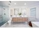 Elegant bathroom with double sinks, marble countertops, and walk-in shower at 35 Deerpath Dr, Oldsmar, FL 34677
