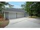 Spacious three-car garage with a wide driveway offering ample parking space for residents and guests at 35 Deerpath Dr, Oldsmar, FL 34677
