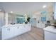 Spacious kitchen features white cabinets, stainless steel appliances, quartz countertops, and ample natural light at 35 Deerpath Dr, Oldsmar, FL 34677