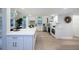Bright kitchen features white cabinets, stainless steel appliances, quartz countertops, and breakfast nook at 35 Deerpath Dr, Oldsmar, FL 34677