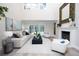 Bright living room with a fireplace and access to the backyard pool area at 35 Deerpath Dr, Oldsmar, FL 34677