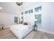 Bright main bedroom featuring high ceilings, wood floors and multiple windows at 35 Deerpath Dr, Oldsmar, FL 34677