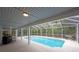 Covered swimming pool area, perfect for relaxing and entertaining at 35 Deerpath Dr, Oldsmar, FL 34677