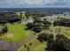 Scenic aerial view of a lush golf course community, with serene ponds and winding pathways at 36901 Tara Ave, Zephyrhills, FL 33542