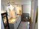 This bathroom has double sinks, granite countertops and white cabinetry at 36901 Tara Ave, Zephyrhills, FL 33542