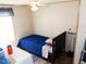 Modest bedroom with a bed and a window, providing a cozy and functional space at 36901 Tara Ave, Zephyrhills, FL 33542
