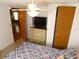 Bedroom with ceiling fan, dresser and large window at 36901 Tara Ave, Zephyrhills, FL 33542