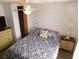 Bedroom features a ceiling fan, large bed, and dresser at 36901 Tara Ave, Zephyrhills, FL 33542