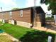 The home features well-maintained siding and stone accents, with a convenient storage building at 36901 Tara Ave, Zephyrhills, FL 33542