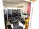 Golf cart parked inside of garage with lots of accessories at 36901 Tara Ave, Zephyrhills, FL 33542